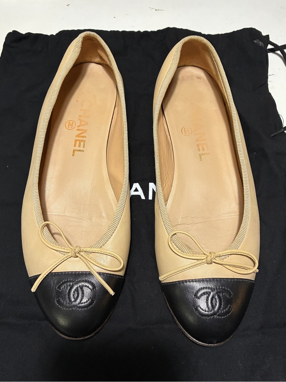 CHANEL Beige Leather Ballet Flats with Black Cap Toe and CC Logo